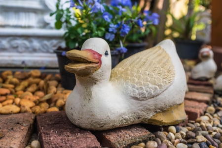 cheerful duck sculpture decoration in the gardenの写真素材