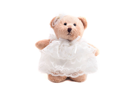 cute teddy bear in wedding dress isolated in white background with clipping pathの写真素材