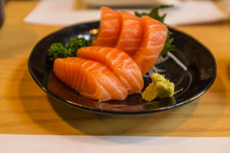 fresh salmon served in japanese restaurantの写真素材