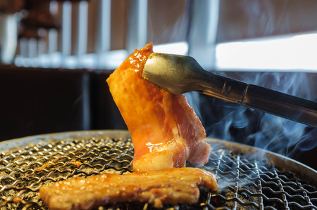 grill pork belly in korean restaurantの写真素材