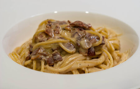 spaghetti with carbonara sauce and baconの写真素材