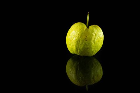 Guava on black acrylic.This is lowkey photo.の写真素材
