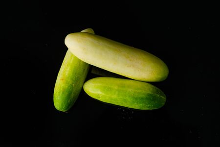 Close up Cucumber on black acrylic.This is low-key photoの写真素材