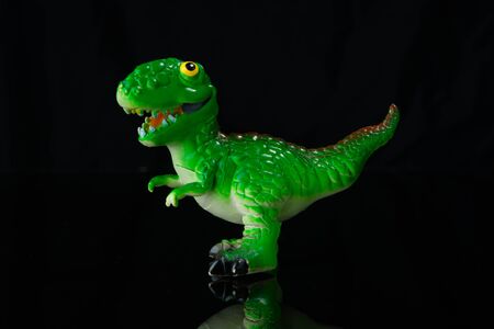 Dinosaur Toy Isolated On black acrylic.This is low-key photoの写真素材