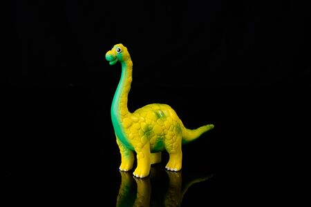 Dinosaur Toy Isolated On black acrylic.This is low-key photoの写真素材