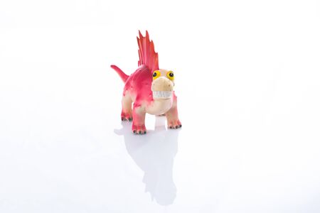 Dinosaur Toy Isolated On White acrylic.This is high-key photoの写真素材