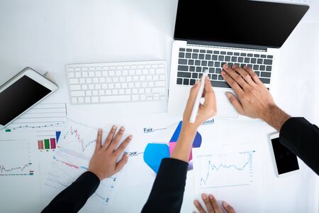 Consultation of Business man and business woman consider business plan in office workersの写真素材