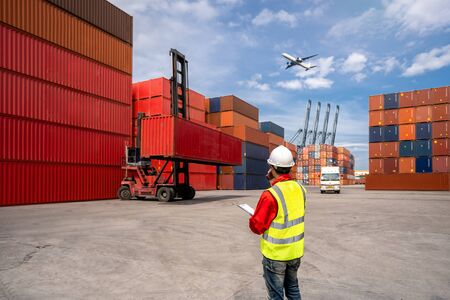 Foreman control loading Containers box to truck for Logistic Import Export Background, Business...