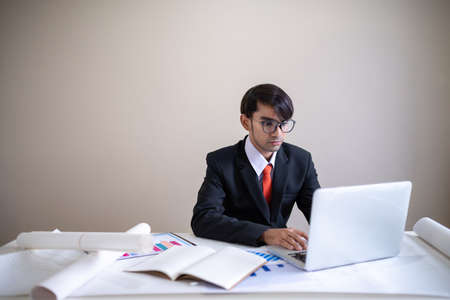 Business man working with laptop and documents on his desk.analyzing data in officeの写真素材
