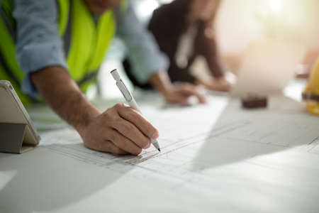 Consultation of Business man and business woman consider business plan in office workersの写真素材