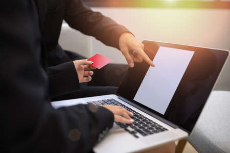 Consultation of Business man and business woman consider business plan in office workersの写真素材