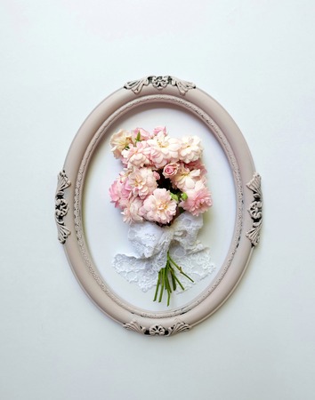 A bouquet of pink roses in vintage frames .の写真素材