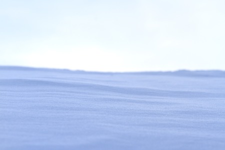 snow drifts and gray skyの写真素材