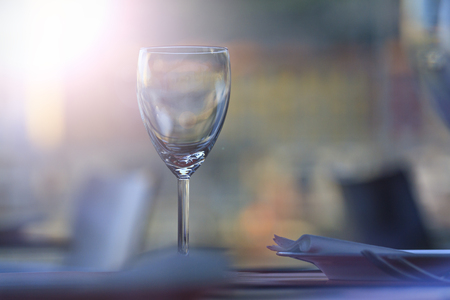 one glass of wine is on the table with sunny hotspot,restaurant wine list, a table with a glass, interior cafes, themed restaurantの写真素材