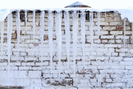icicles in the winter hang under the roof, winter, frosty dayの写真素材