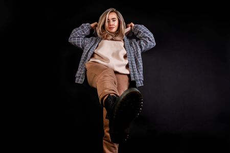 girl steps on a black backgroundの写真素材