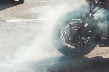 motorcycle wheel smokes on asphalt, spring periodの写真素材