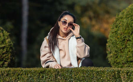 beautiful brunette in autumn parkの写真素材