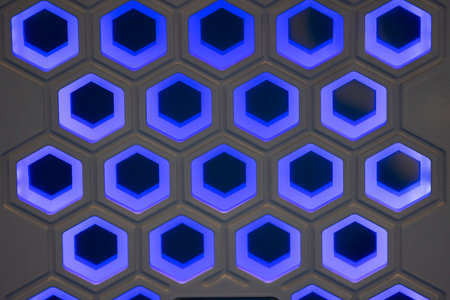 neon abstract honeycombs on the wallの写真素材