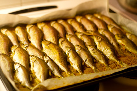 baked fish lies on a baking trayの写真素材