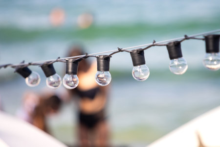 string lights set up on beach for night event