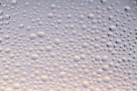 Macro Water Drops on Glass. Blue Condensationの写真素材