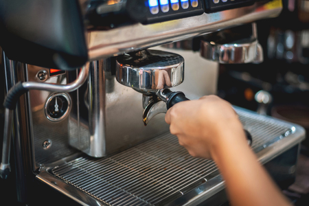 Barista preparing to make coffee in coffee shop, coffee making machineの写真素材