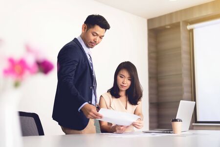 Business man and woman discussion in the office, business strategy planningの写真素材