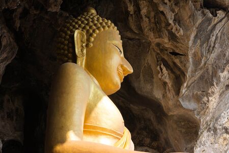 A majestic buddha statue in thailandの写真素材