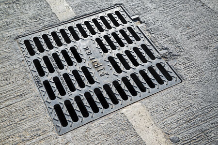 Manhole cover metal in a city streetのeditorial素材