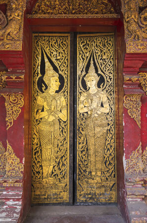 pattern in traditional Thai style art painting on door of the temple の写真素材