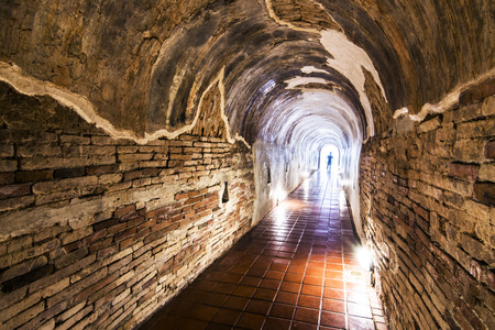 silhouette in a old tunnel  Light at End of Tunnel の写真素材