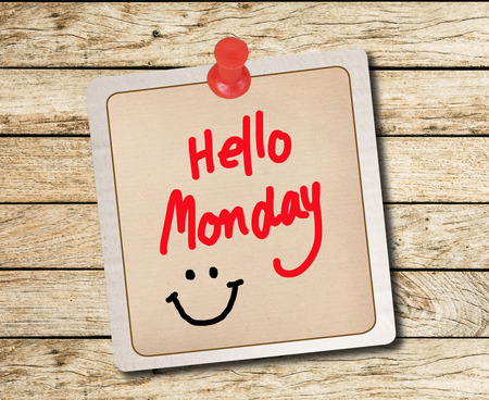 Hello Monday on note recycle paper isolated on wood background の写真素材