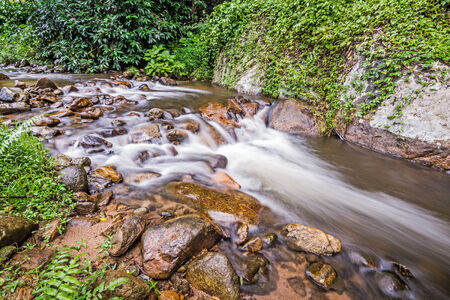Water flowing over rocks in a creek. の写真素材