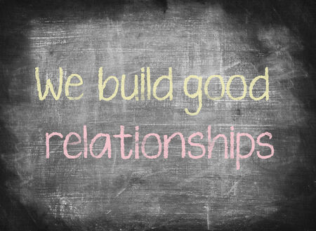 We build good relationships,writing on chalkboardの写真素材