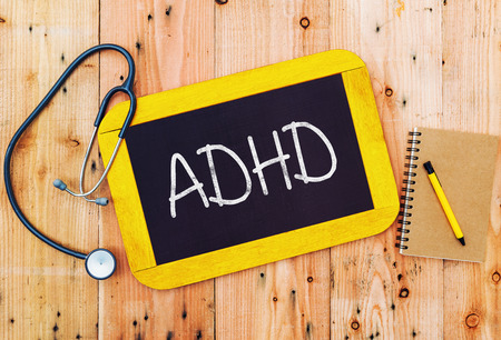 ADHD handwritten on blackboard , medecine concept.の写真素材