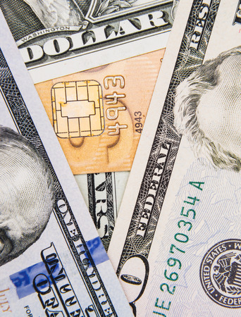 American dollar bills and a credit card concepts of financeの写真素材
