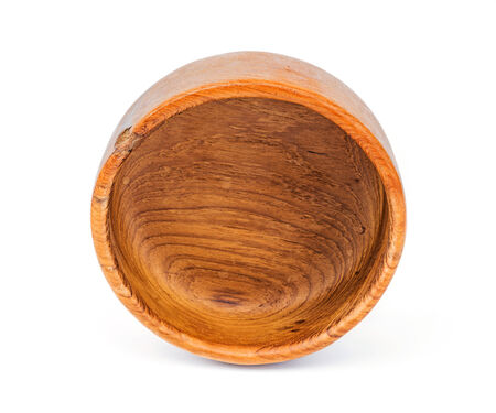 Handmade teak wooden bowl isolated on white backgroundの写真素材