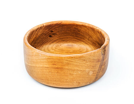 Handmade teak wooden bowl isolated on white backgroundの写真素材