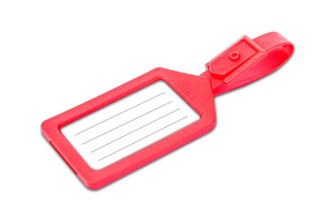 Red luggage tag with copy space over white backgroundの写真素材