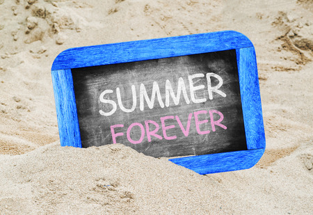 Summer Forever written in chalkboard on beachの写真素材