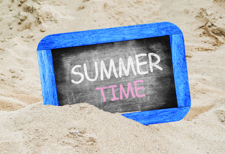 Summer Time written with chalk on a blackboardの写真素材