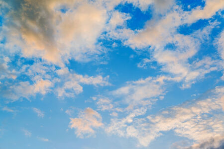Orange clouds in blue sky, sunset sky