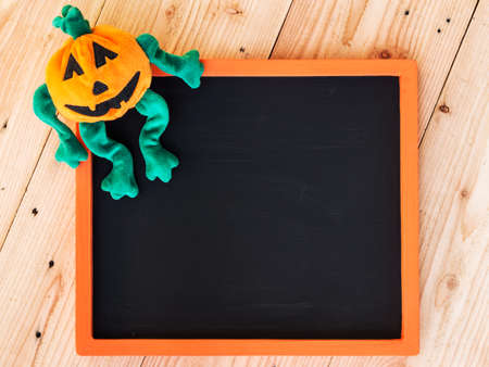 Halloween pumpkin, writting about Halloween in chalkboard.の写真素材