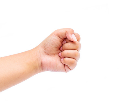Female hand with clenched a fist, isolated on a white backgroundの写真素材