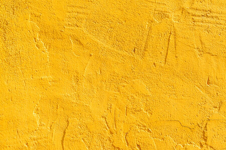 Yellow concrete wall backgroundの写真素材