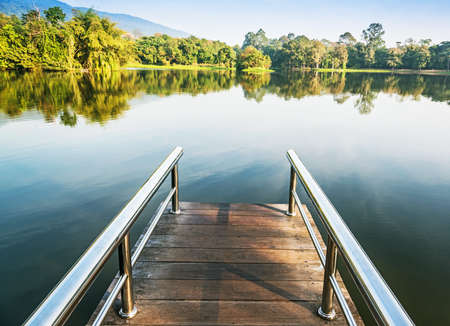Bridge in the lake in morning ,Chiang Mai, Thailand.の写真素材