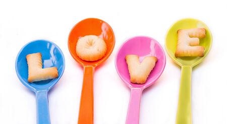 Alphabet Biscuits , word \ LOVE \ in colorful spoons.