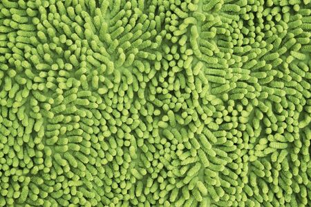Green cleaning feet doormat or carpet textureの写真素材