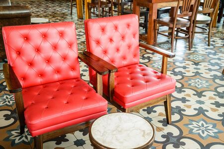Red chairs in coffee shop backgroundの写真素材
